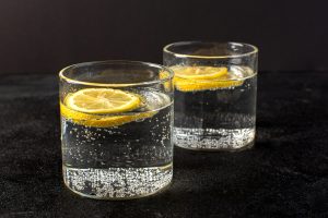 front-closed-up-view-water-with-lemon-fresh-cool-drink-with-sliced-lemons-inside-transparent-glasses.jpeg