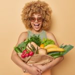 horizontal-shot-surprised-amazed-curly-haired-young-woman-embraces-fresh-vegetables-fruits-wrapped-p.jpeg