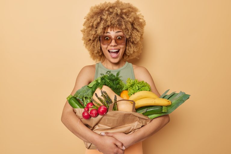 horizontal-shot-surprised-amazed-curly-haired-young-woman-embraces-fresh-vegetables-fruits-wrapped-p.jpeg